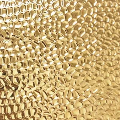 Il colore dell'oro ha impresso il modello del favo dello strato di acciaio inossidabile